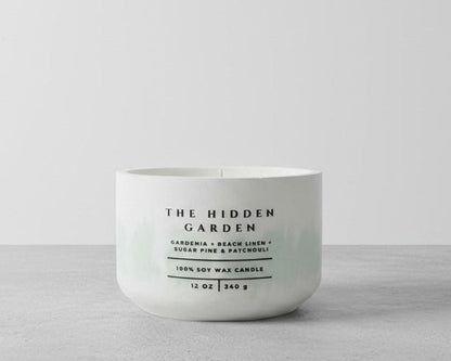 The Hidden Garden Christian Soy Candle with Gardenia, Beach Linen, Sugar Pine, and Patchouli in a Handcrafted Concrete Vessel.