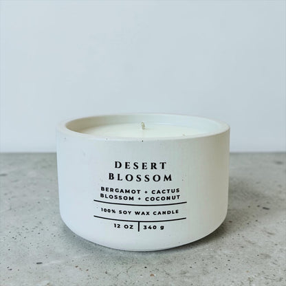 Desert Blossom soy wax candle with bergamot, cactus blossom and coconut fragrance in handcrafted white concrete vessel. Luxury home fragrance, Christian gift and faith-inspired home decor by Boswellia Candle Co.