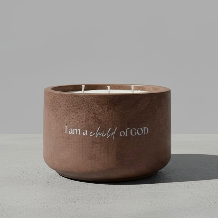Golden Ground Christian Soy Candle featuring 'I Am a Child of God' affirmation in a handcrafted concrete vessel with Palo Santo, Sandalwood, Frankincense, and Vanilla.