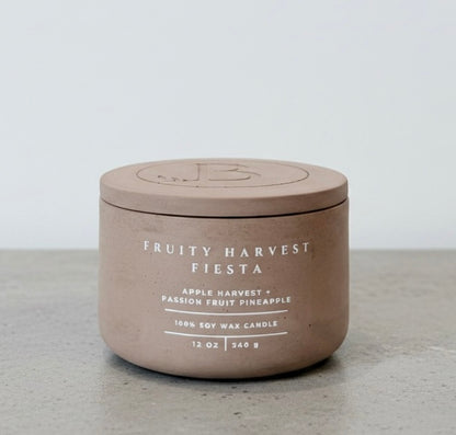 Fruity Harvest Fiesta luxury soy wax candle with matching concrete lid, handcrafted vessel featuring apple harvest, passion fruit, and pineapple fragrance notes. Faith-inspired gift by Boswellia Candle Co.