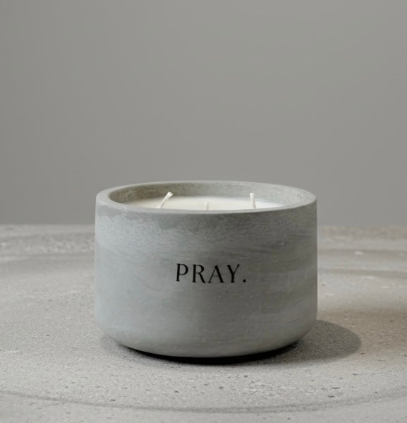 PRAY. faith-inspired 12 oz soy wax candle in a handcrafted gray concrete vessel, designed as a daily reminder to pause, pray, and trust in God.