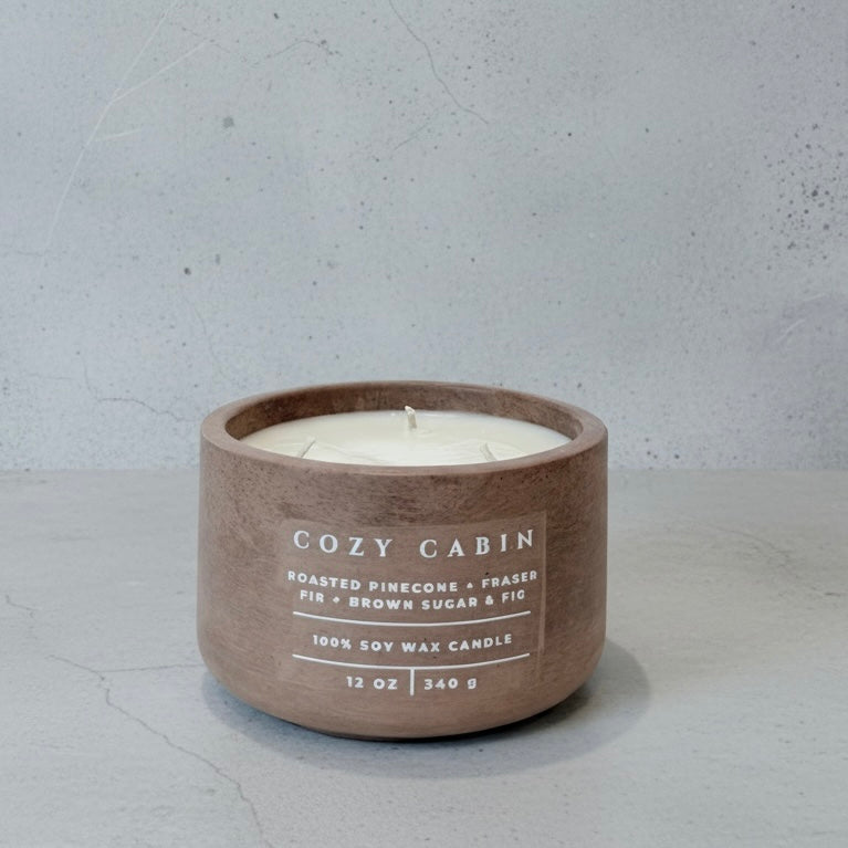 Cozy Cabin Christian soy wax candle with Fraser fir, roasted pinecone, and brown sugar fig fragrance in a handcrafted concrete vessel. Faith-inspired home décor by Boswellia Candle Co.
