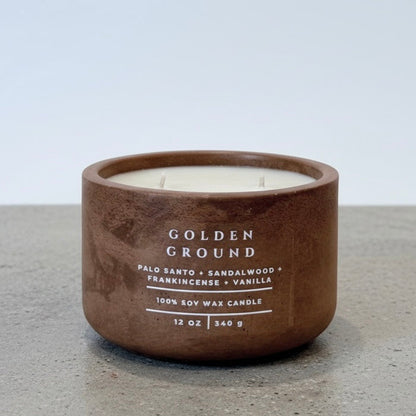 Golden Ground Scripture Candle, 12 oz soy wax candle in a handcrafted concrete vessel with notes of palo santo, sandalwood, frankincense, and vanilla.