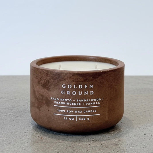 Golden Ground Scripture Candle, 12 oz soy wax candle in a handcrafted concrete vessel with notes of palo santo, sandalwood, frankincense, and vanilla.