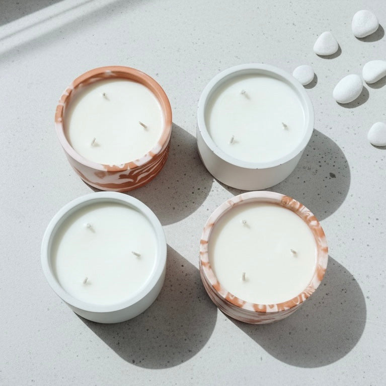 Luxury soy wax candle collection in handcrafted concrete vessels featuring white and terrazzo designs. Modern home fragrance, artisan candles, Christian gifts and faith-inspired home decor by Boswellia Candle Co.