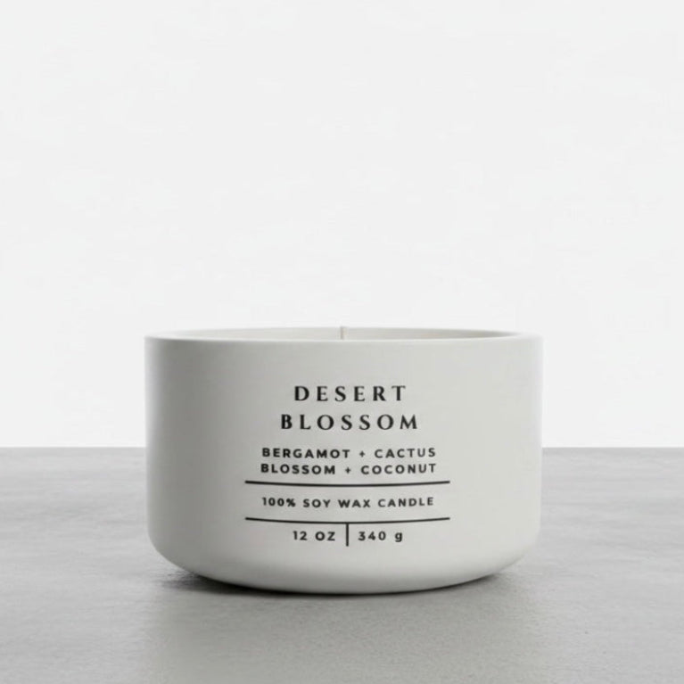 Desert Blossom soy wax candle with bergamot, cactus blossom and coconut fragrance in handcrafted white concrete vessel. Luxury home fragrance, Christian gift and faith-inspired home decor by Boswellia Candle Co.