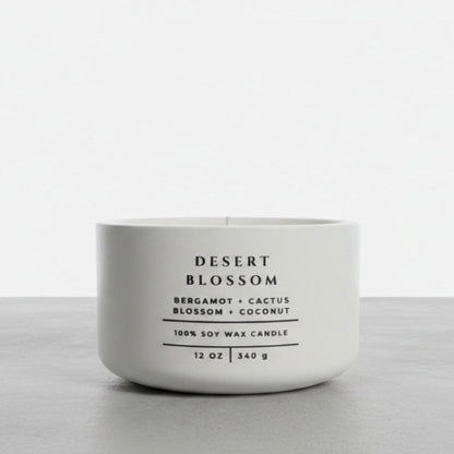 Desert Blossom soy wax candle with bergamot, cactus blossom and coconut fragrance in handcrafted white concrete vessel. Luxury home fragrance, Christian gift and faith-inspired home decor by Boswellia Candle Co.