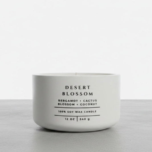 Desert Blossom soy wax candle with bergamot, cactus blossom and coconut fragrance in handcrafted white concrete vessel. Luxury home fragrance, Christian gift and faith-inspired home decor by Boswellia Candle Co.