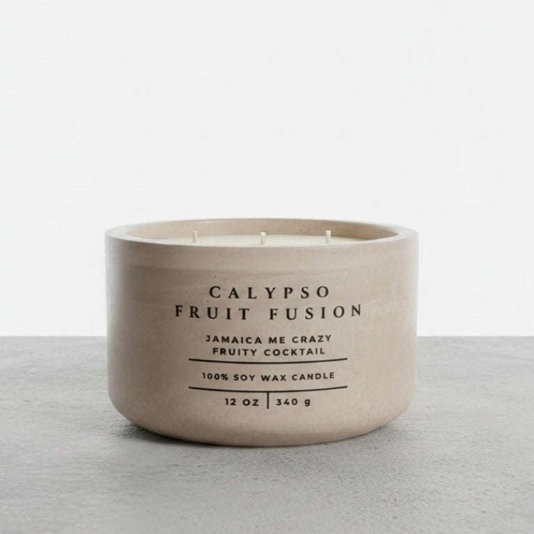 Calypso Fruit Fusion tropical soy wax candle in a handcrafted concrete vessel, featuring Jamaica Me Crazy fragrance notes. Luxury Christian candle and faith-inspired gift by Boswellia Candle Co.