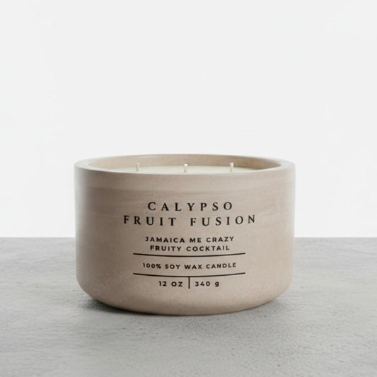 Calypso Fruit Fusion tropical soy wax candle in a handcrafted concrete vessel, featuring Jamaica Me Crazy fragrance notes. Luxury Christian candle and faith-inspired gift by Boswellia Candle Co.