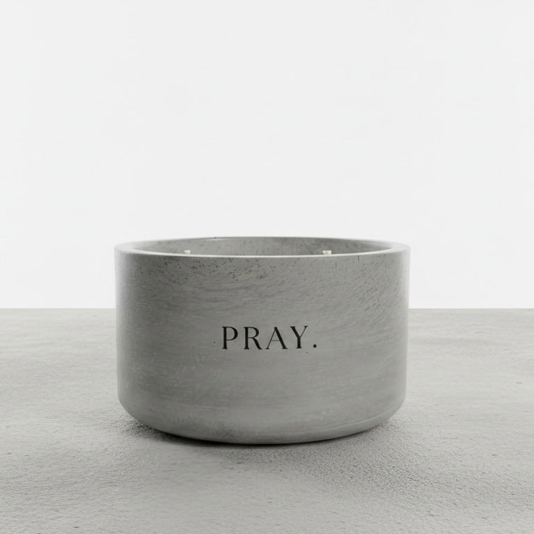 PRAY. faith-inspired 12 oz soy wax candle in a handcrafted gray concrete vessel, designed as a daily reminder to pause, pray, and trust in God.