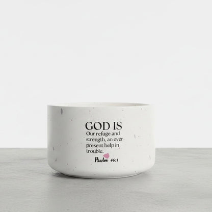 Aurora Petals floral soy wax candle with Psalm 46:1 Bible verse, handcrafted in a white terrazzo concrete vessel and scented with freesia, lilac, and jasmine.