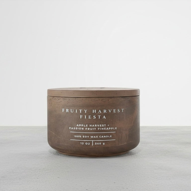 Fruity Harvest Fiesta luxury soy wax candle with matching concrete lid, handcrafted vessel featuring apple harvest, passion fruit, and pineapple fragrance notes. Faith-inspired gift by Boswellia Candle Co.