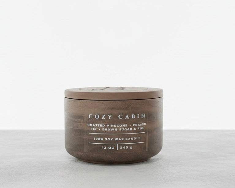 Cozy Cabin luxury soy wax candle with matching concrete lid, featuring roasted pinecone, Fraser fir, and brown sugar fig fragrance. Christian gift by Boswellia Candle Co.